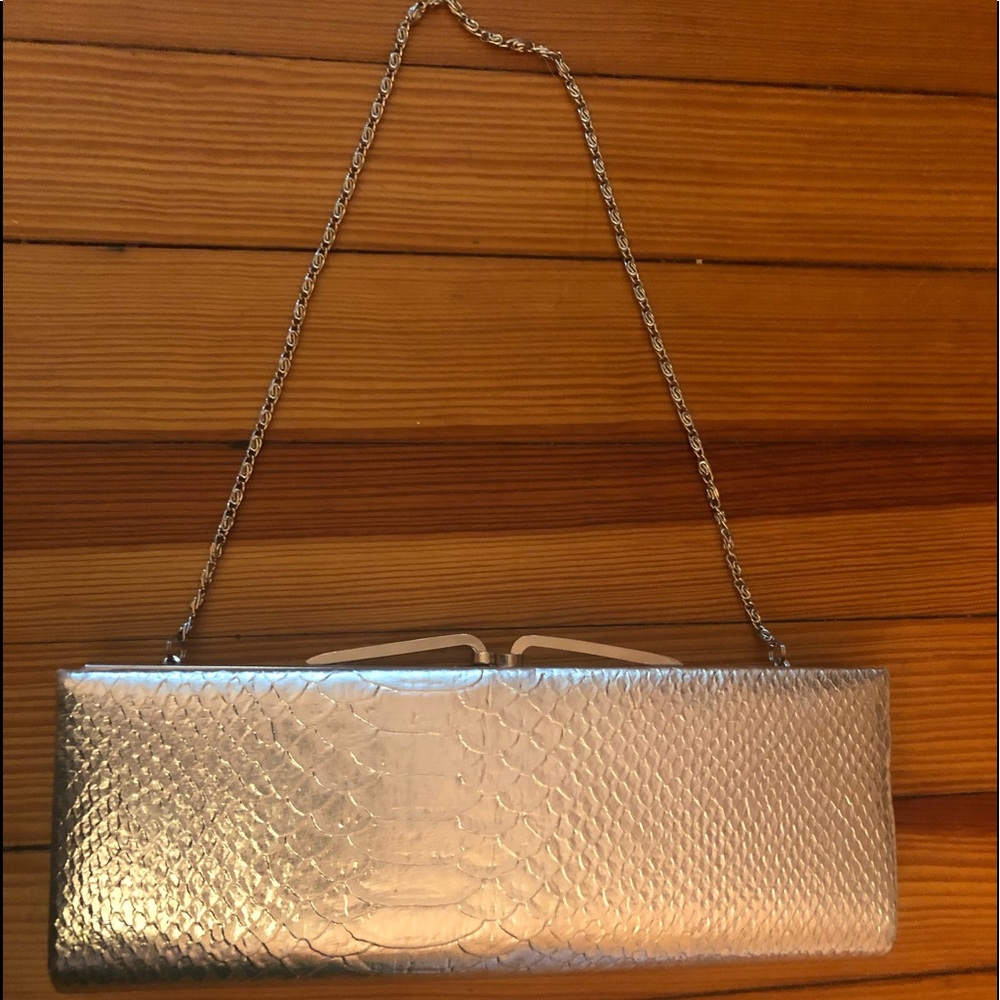 NWOT “Lovely N.Y”silver metallic faux snake clutch